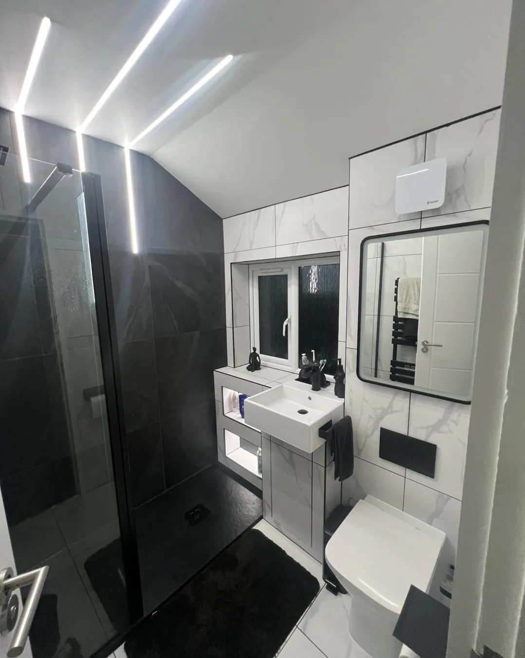 LED strip lighting installed in a modern bathroom by a Preston electrician: electrician in Bamber Bridge