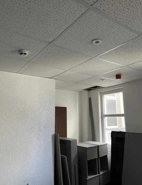 Ceiling smoke detector fitted in an office as part of a Preston fire alarm installation