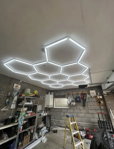 Hexagon LED lighting installed in a garage workshop in Preston