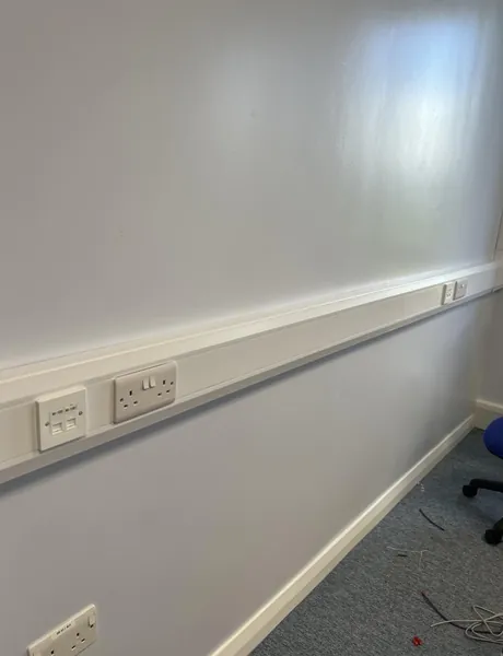 Neat trunking and double sockets installed in an office in Preston