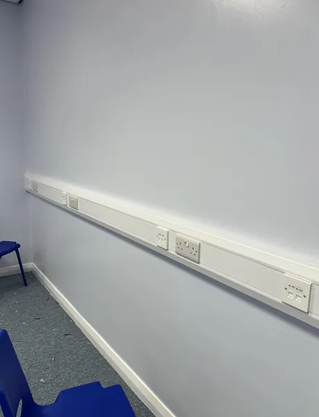 Skirting trunking with new double sockets fitted by an electrician in Preston