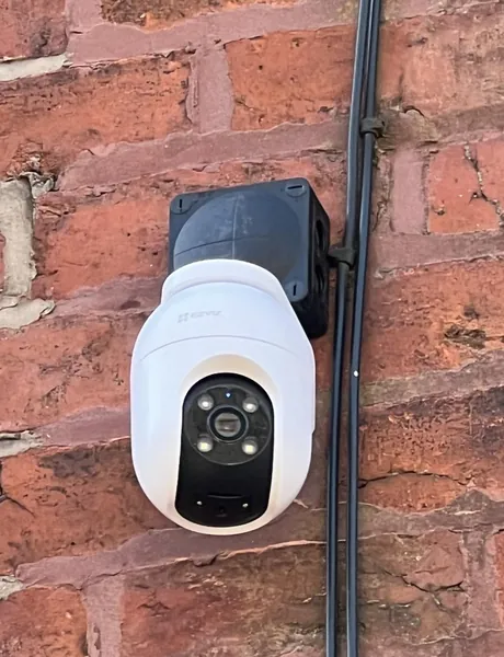 Wireless CCTV camera installation on a brick wall in Preston